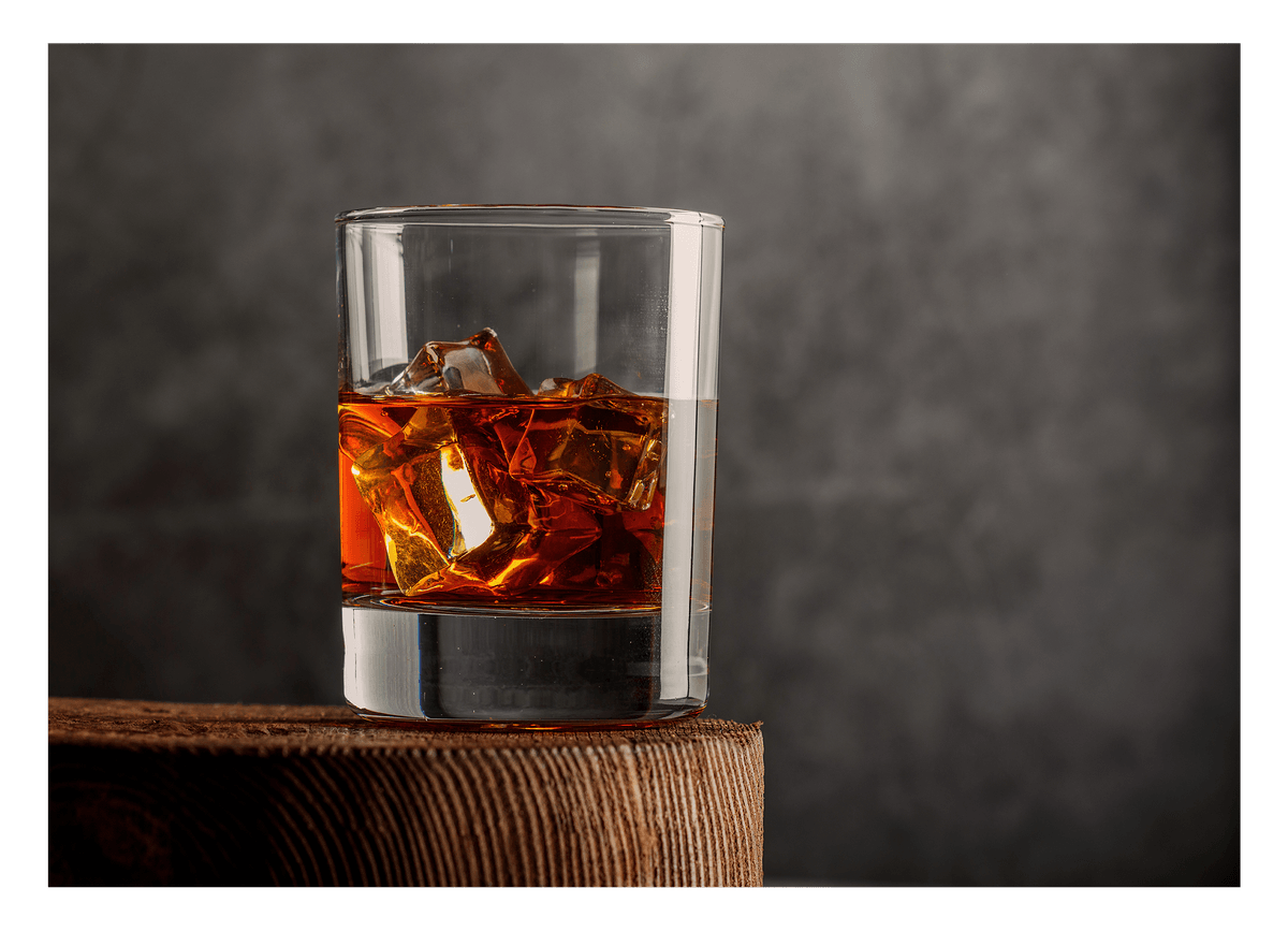 Whisky glass with ice cubes - Elegant drink photography