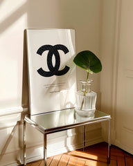 After Hover: Coco Chanel logo with dark pinstripes - quote from the fashion icon